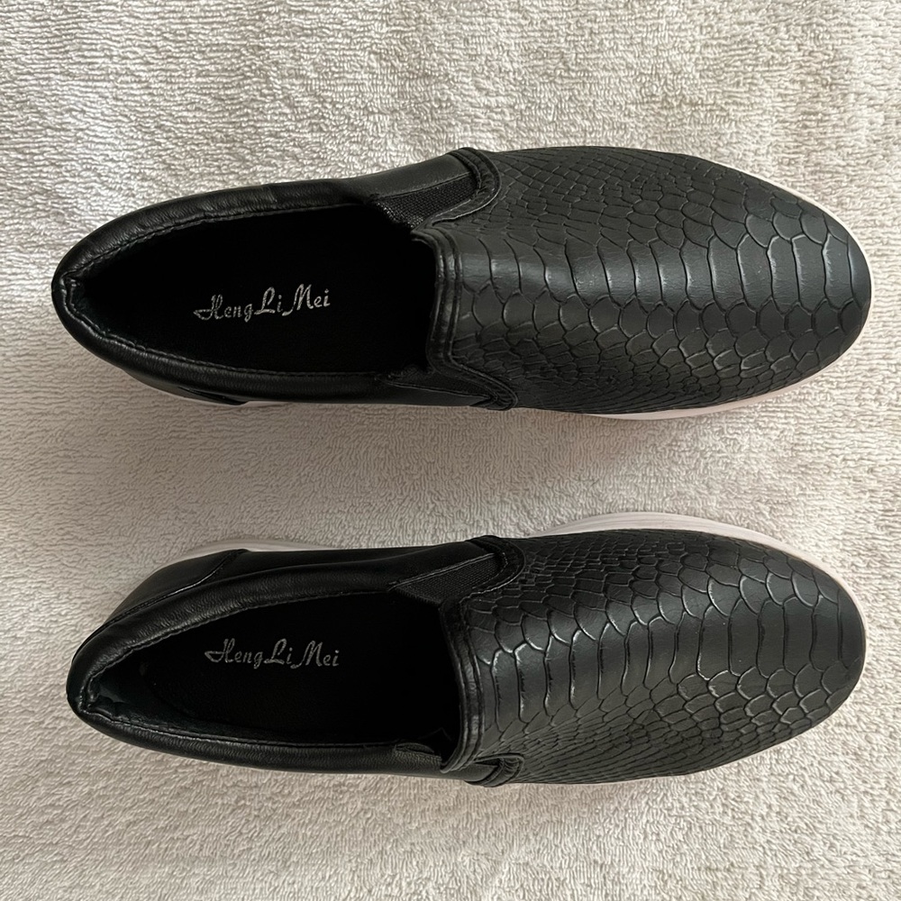 Ladies black platform slip on sneakers